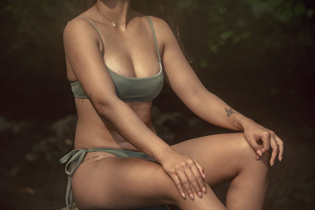 Woman relaxed after natural-looking Motiva Preservé breast augmentation at Lux Plastic Surgery